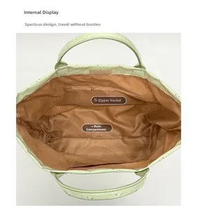 Top view of the light green tote bag showing the interior layout and zipper pocket