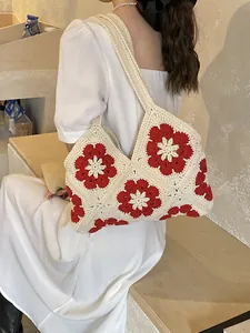 Bohemian crochet tote bag with red floral patterns and comfortable wide shoulder straps