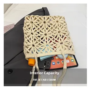 Internal capacity of hollow floral crochet tote bag holding phone and tablet