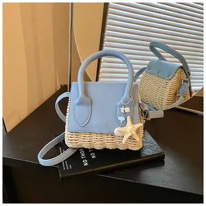 Close-up of mini straw handbag with blue leather trim and starfish shell charms