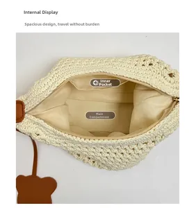 Internal view of crochet tote bag showing beige fabric lining and zipper pocket details