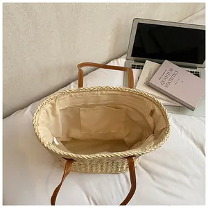Top view of woven tote bag showing large main compartment and interior pocket detail