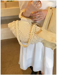 Close-up of woven cotton tote bag featuring bohemian texture and wooden handle