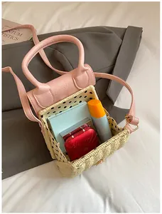 Detail view of pink straw woven bag with polka dot lining and cosmetics inside
