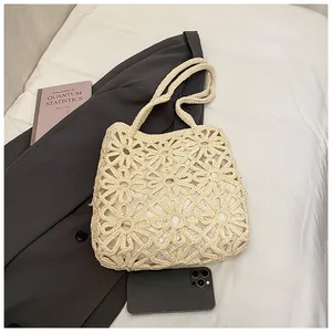 Detailed close-up of daisy crochet hollow pattern on beige woven tote bag with soft lining