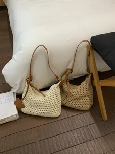 Bohemian style crochet hobo tote bag in beige and light brown with soft leather straps