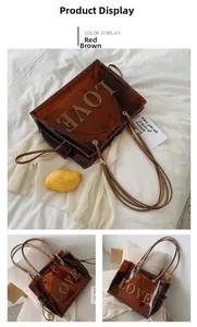 Detail view of transparent red-brown jelly tote bag with LOVE patch and inner pouch