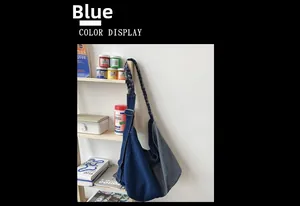 Detail of blue denim patchwork tote bag with woven shoulder strap in lifestyle setting