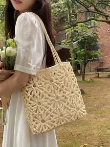 Beige floral crochet knit tote bag with hollow-out pattern for beach vacation style