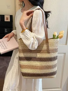 Rainbow striped woven straw tote bag with brown leather straps and gold zipper closure