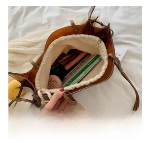 Detail view of large transparent tote bag interior showing spacious capacity for essentials