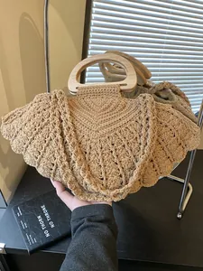 Handmade woven cotton tote bag with wooden handles and fan-shaped crochet texture