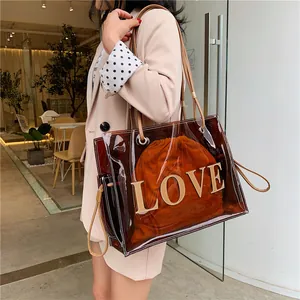 Transparent brown PVC tote bag with LOVE lettering and orange drawstring inner pouch