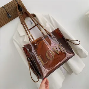 Brown 2-in-1 transparent PVC tote bag with leather LOVE patch and drawstring inner bag