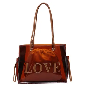 Brown transparent PVC tote bag with LOVE lettering and inner drawstring pouch