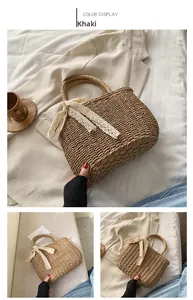 Detail of khaki straw beach bag with elegant white lace ribbon and sturdy woven texture
