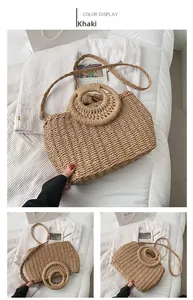 Dettaglio borsa in paglia intrecciata kaki con manici rotondi e tracolla coordinata