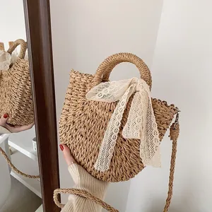 Straw hand-woven semicircular bucket bag with white lace bow and shoulder strap