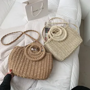 Grande borsa da spiaggia intrecciata in paglia per donna nei colori beige e marrone