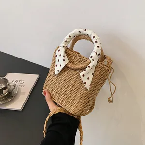 Straw hand-woven bag with silk scarf handle and long crossbody strap for beach resort fashion