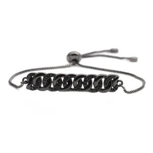 Macro detail of gunmetal cuban link bracelet with black pavé micro-inlaid zircons