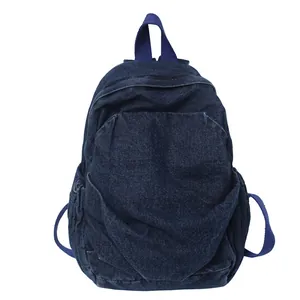 Mochila vintage de mezclilla lavada azul oscuro con bolsillo frontal y bolsillos laterales