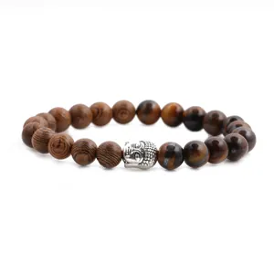 Detailed macro of 8mm tiger eye beads and wood beads with silver Buddha head spacer