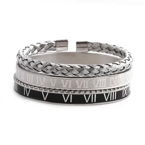 Detailed shot of three-piece stainless steel bracelets with Roman numerals and braided texture