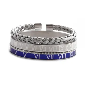 Detail of three-piece stainless steel bracelet set with Roman numerals and braided texture