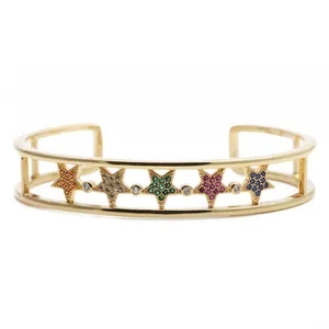 Gold-plated open star bangle with colorful cubic zirconia inlays on a white background