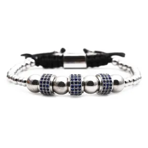 Close-up of beaded bracelet with blue cubic zirconia charms and adjustable black cord