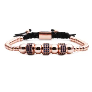 Detail of rose gold beaded bracelet featuring micro-pave blue stones and adjustable drawstring