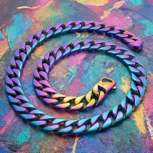 Macro shot of 15mm rainbow iridescent cuban link chain with textured oil painting background