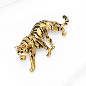 Golden tiger brooch with black enamel stripes and realistic walking animal pose