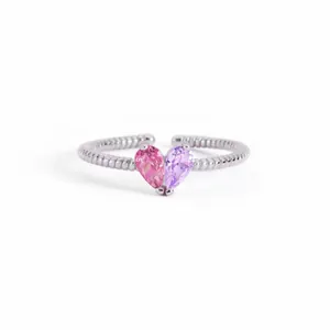 Detailed view of adjustable silver ring with pink and purple heart-shaped stones