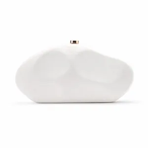 Close-up of white snake-skin texture acrylic clutch bag in irregular stone shape.