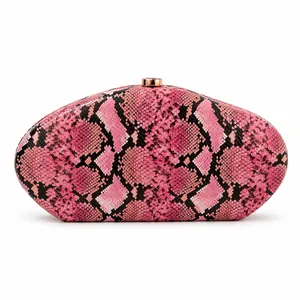 Detailed macro view of pink snakeskin pattern acrylic evening clutch with gold clasp