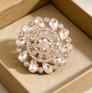 Luxurious rose gold flower brooch with sparkling crystals in a rustic brown gift box