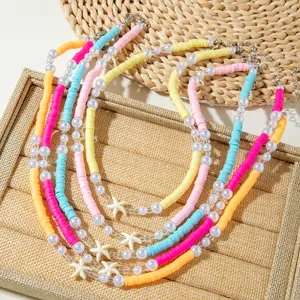Detail of bohemian beach necklace with colorful heishi beads and starfish pendant
