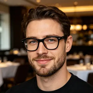 Detail shot of men's vintage black cat-eye optical frames worn by a male model