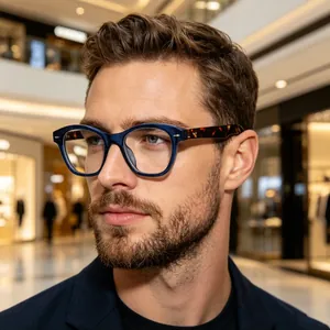 Close-up detail of retro blue and tortoiseshell optical glasses on a male model