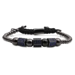 Detail of adjustable black beaded bracelet with blue zircon micro-pave charms