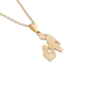 Detail view of gold stainless steel necklace with mother and child silhouette pendant