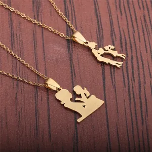 Gold mother and child silhouette pendants on minimalist stainless steel chains