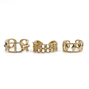 Three-piece gold plated adjustable rings featuring twisted chain and hollow diamond designs