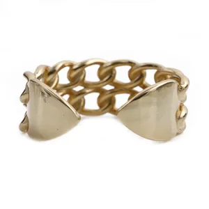 Detail of gold Cuban link chain ring featuring heart-shaped ends and adjustable open band