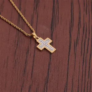 Detail of gold hip hop cross pendant featuring micro-set sparkling cubic zirconia stones