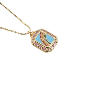 Gold plated necklace with rectangle blue enamel pendant and rainbow gemstone detail