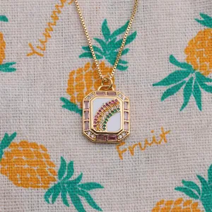 Detailed close-up of a 18K gold-plated rainbow pendant necklace with colorful zircons