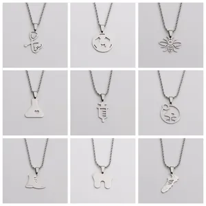 Set mit neun polierten Edelstahl-Anhängern mit medizinischen und Natur-Motiven